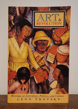 Load image into Gallery viewer, Book cover of 'Art & Revolution' on a wooden surface with a white wall background