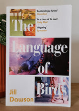 Load image into Gallery viewer, Book titled 'The Language of Birds' by Jill Dawson on a wooden surface.