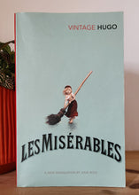 Load image into Gallery viewer, Book titled 'Les Miserables' by Victor Hugo on a shelf.
